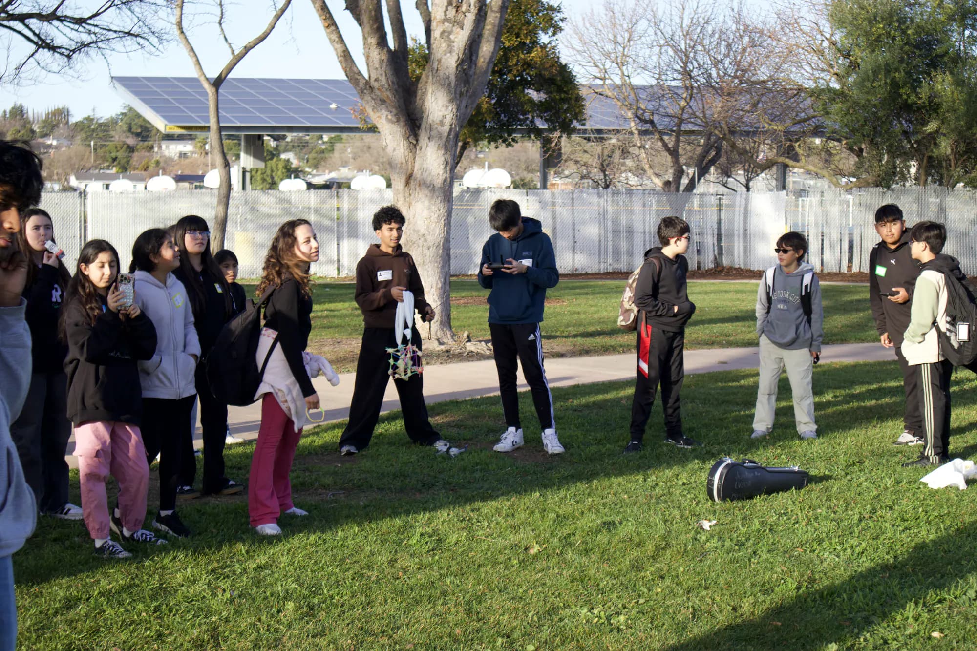Students and volunteers gather outdoors for the Pedrozzi CONNECT egg-drop activity.