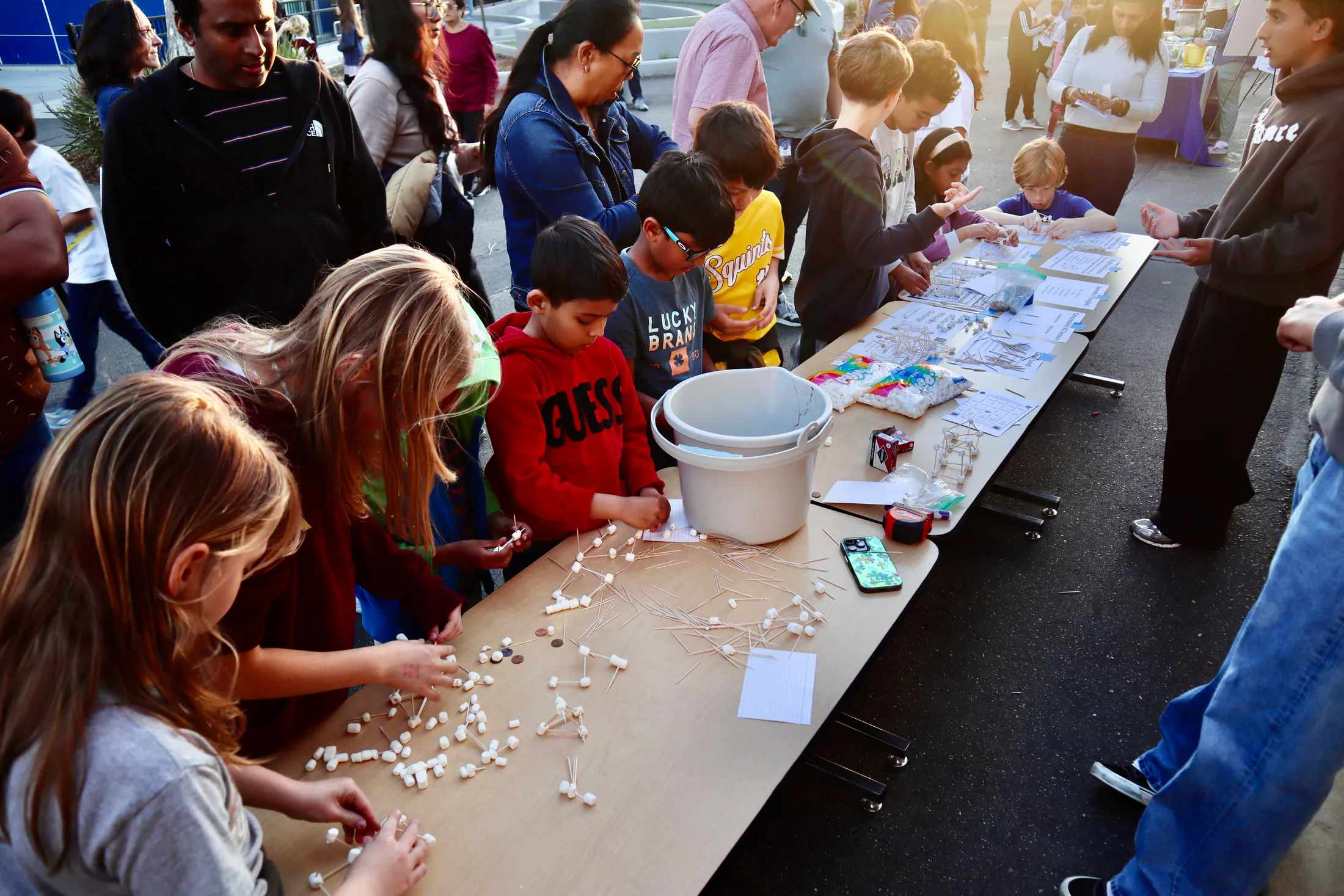Students exploring a science demonstration together.
